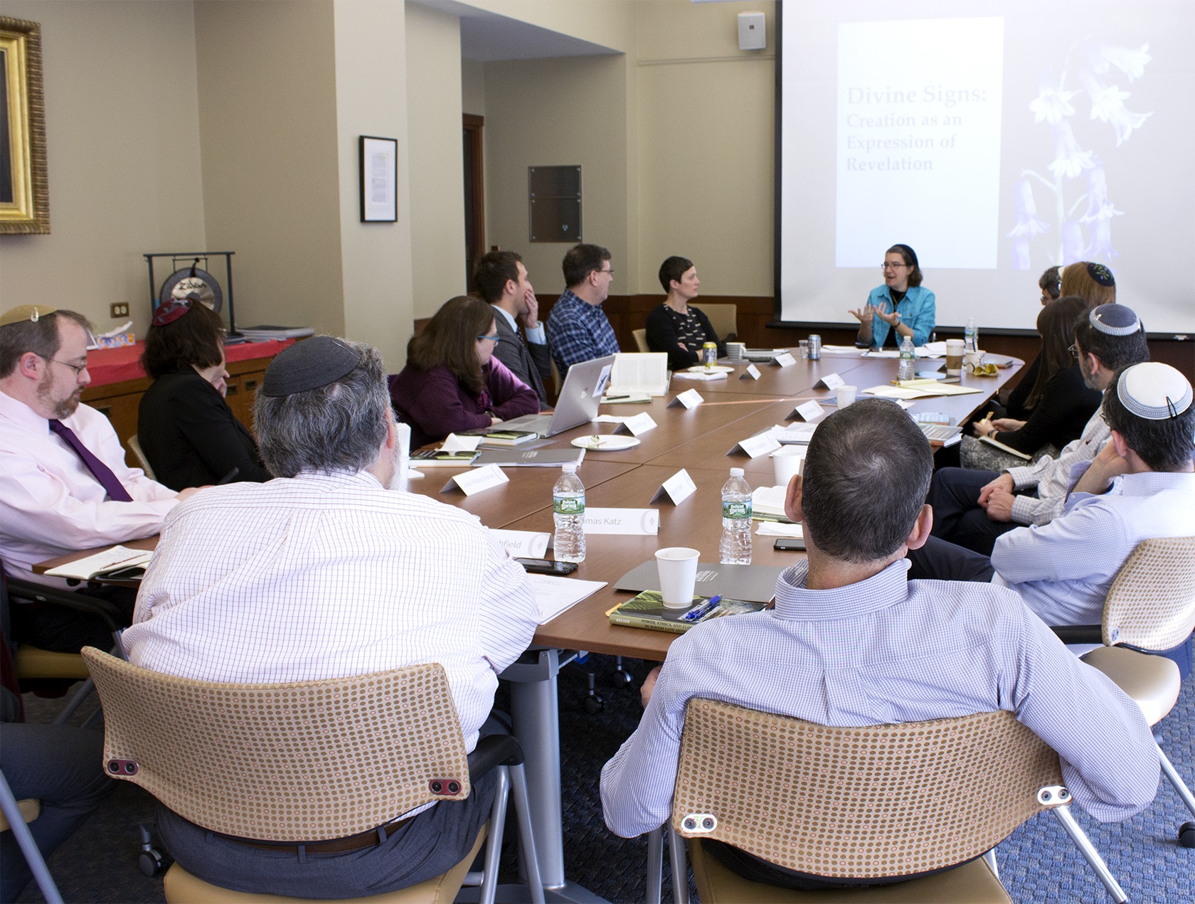 A group of people seated around a conference table