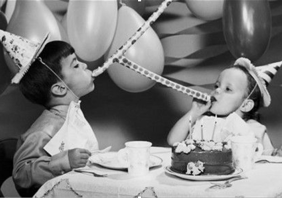 black and white photograph of children celebrating birthday