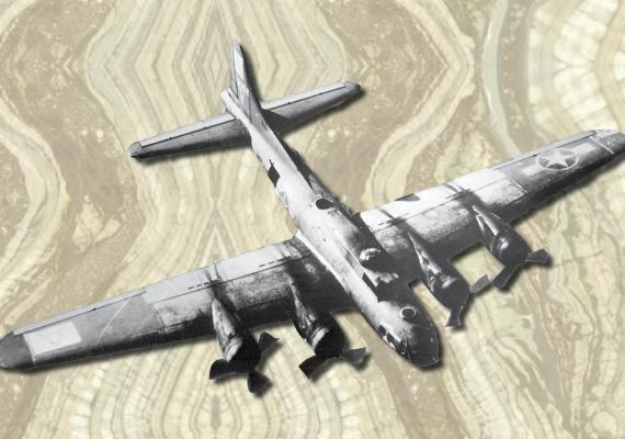 black and white ww2 plane image atop marble background
