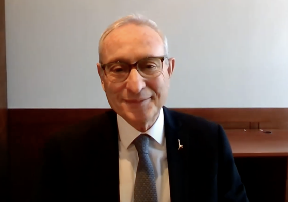 photograph of Menahem Ben-Sasson smiling at desk