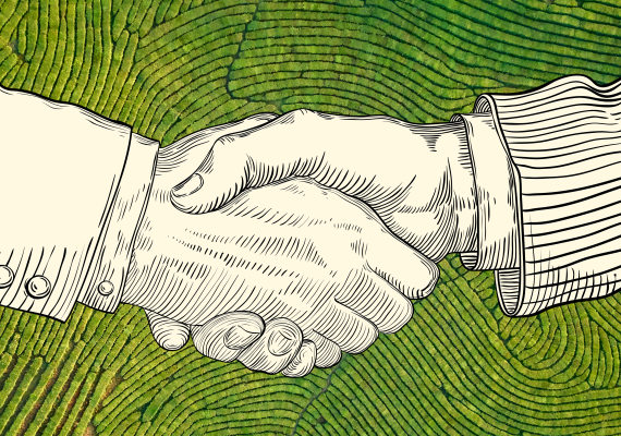 Drawing of shaking hands over aerial view of green field
