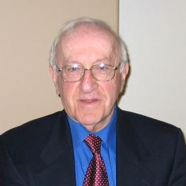 Photograph of elderly man with glasses.