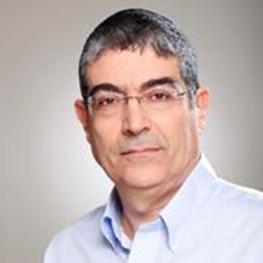 Headshot photograph of man with prominent eyebrows.