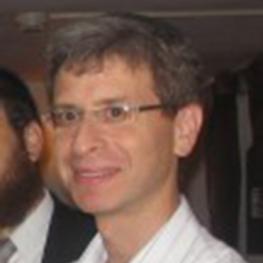 Snapshot photograph of a man at a party.